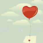 12182911-sobre-con-gran-corazón-volando-en-el-cielo-en-un-globo-en-forma-de-corazón